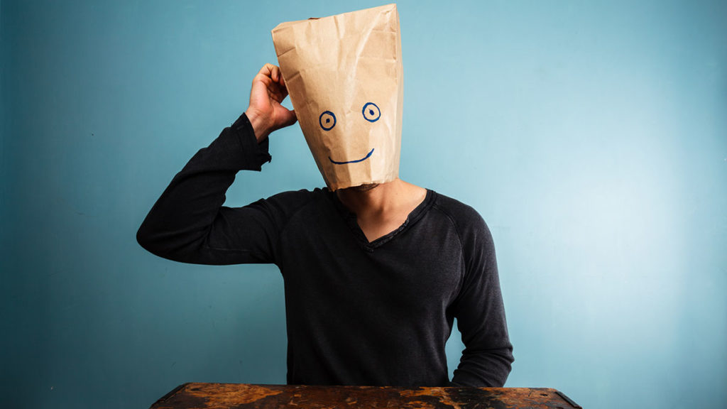 Confused man with bag over his head